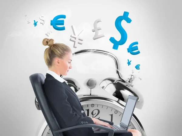 Composite image of businesswoman sitting on swivel chair with laptop — Stock Photo, Image