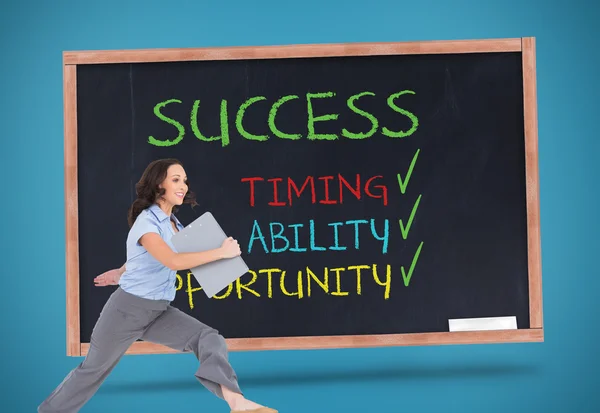 Composite image of cheerful classy businesswoman jumping while holding clipboard — Stock Photo, Image