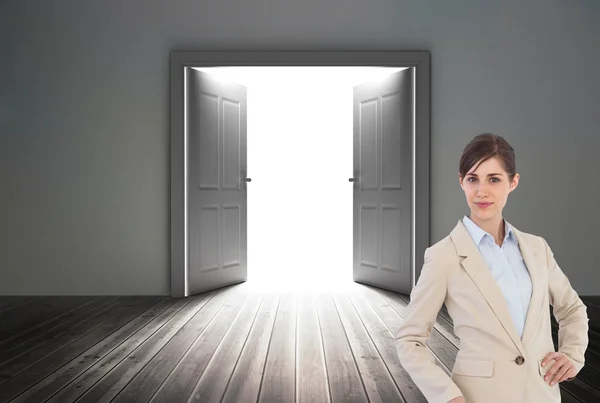 Composite image of businesswoman with suitcase — Stock Photo, Image