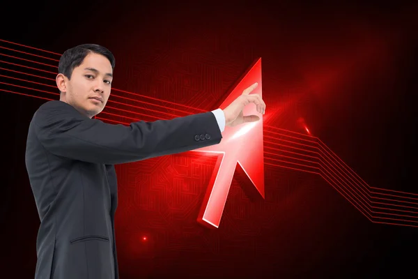 Composite image of serious asian businessman pointing — Stock Photo, Image