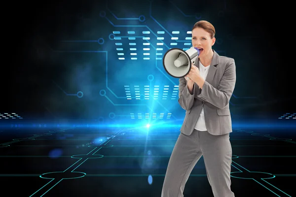 Businesswoman is talking on a megaphone — Stock Photo, Image