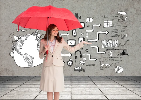 Businesswoman holding red umbrella — Stock Photo, Image