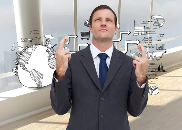 Businessman with fingers crossed is looking up — Stock Photo, Image