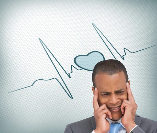 Stressed businessman putting his fingers on his temples — Stock Photo, Image