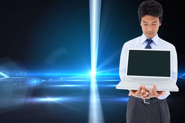 Businessman showing a laptop — Stock Photo, Image