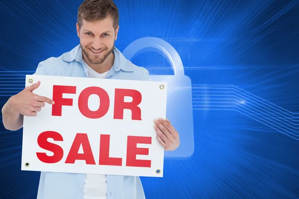 Model holding a for sale sign — Stock Photo, Image