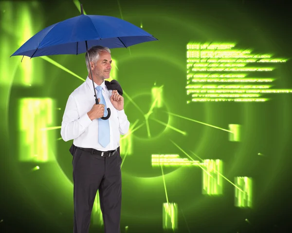 Happy mature businessman holding umbrella — Stock Photo, Image