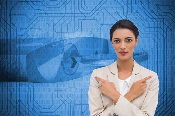 Composite image of charismatic businesswoman with her arms crossed — Stock Photo, Image