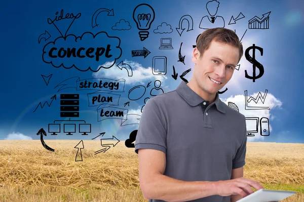 Smiling young man with tablet computer — Stock Photo, Image