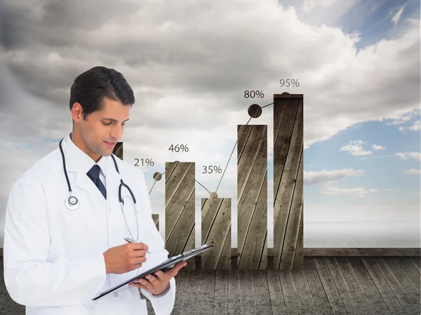 Smiling doctor holding pen and clipboard — Stock Photo, Image