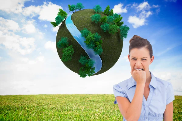 Composite image of furious businesswoman looking at the camera — Stock Photo, Image