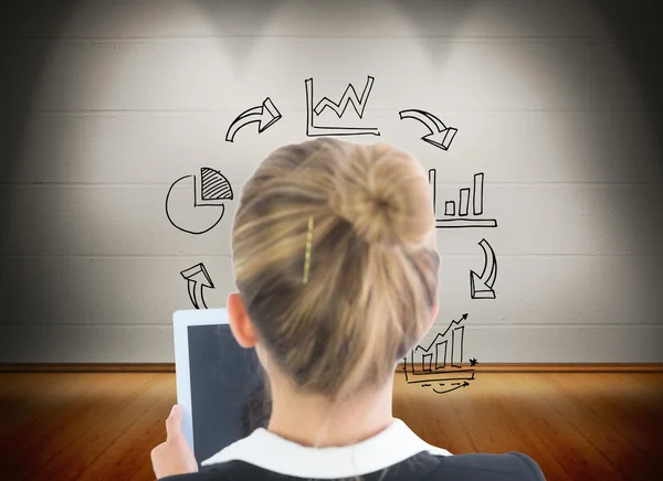 Composite image of businesswoman holding tablet — Stock Photo, Image