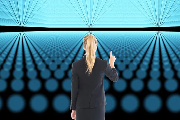 Composite image of businesswoman pointing somewhere — Stock Photo, Image