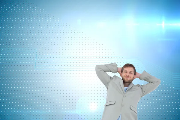 Suave hombre en una chaqueta con las manos detrás de la cabeza — Foto de Stock