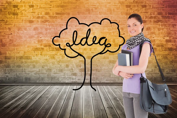 Student holding books and her bag — Stock Photo, Image