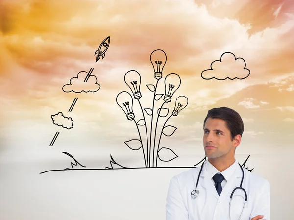 Confident doctor with arms crossed looking up — Stock Photo, Image