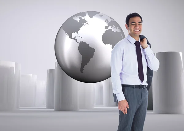 Composite image of smiling businessman standing — Stock Photo, Image