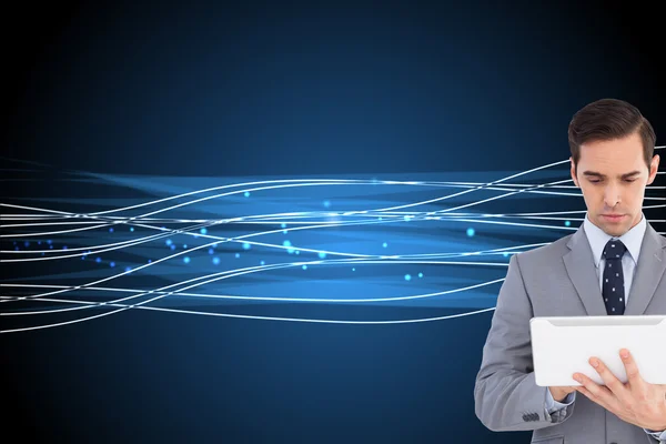 Businessman holding a tablet computer — Stock Photo, Image