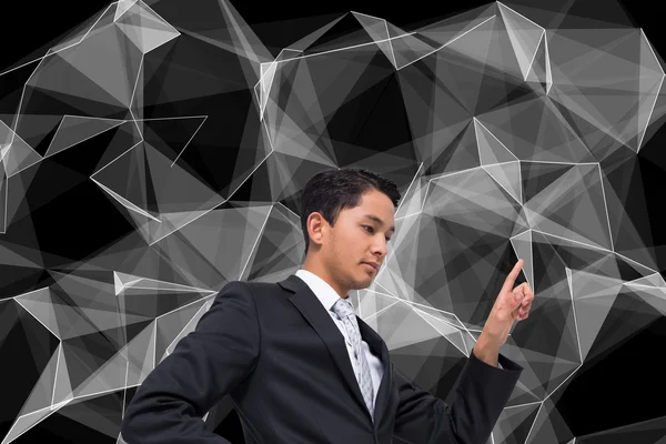 Image composite d'un homme d'affaires asiatique sans sourire pointant du doigt — Photo