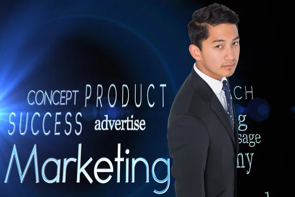 Composite image of serious asian businessman — Stock Photo, Image