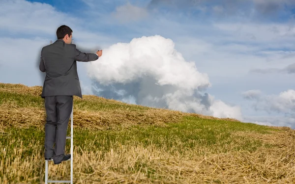 Composite image of businessman standing on ladder — Stock Photo, Image