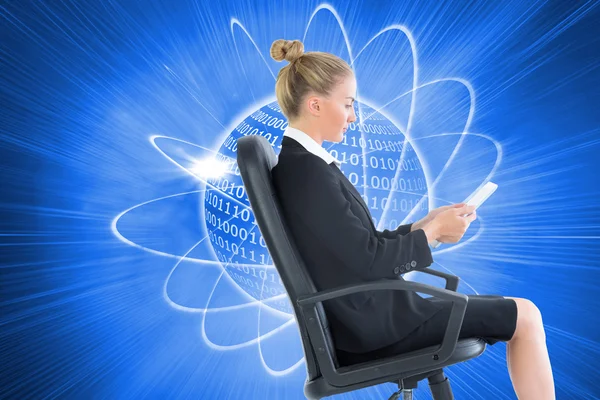 Composite image of businesswoman sitting on swivel chair with tablet — Stock Photo, Image