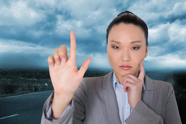 Compuesto imagen de reflexivo asiático mujer de negocios señalando —  Fotos de Stock
