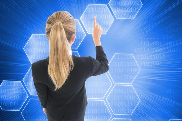 Blonde businesswoman pointing somewhere — Stock Photo, Image