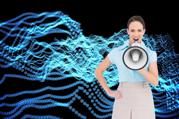 Composite image of furious classy businesswoman talking in megaphone while posing — Stock Photo, Image