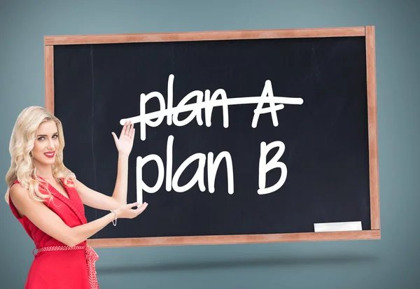 Composite image of smiling blonde presenting — Stock Photo, Image