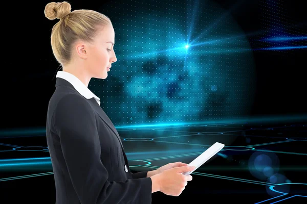 Composite image of businesswoman holding tablet — Stock Photo, Image