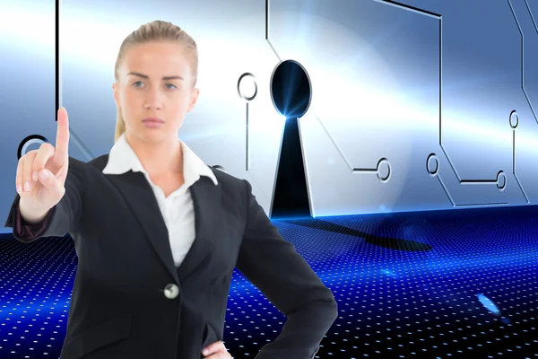 Composite image of businesswoman pointing somewhere — Stock Photo, Image