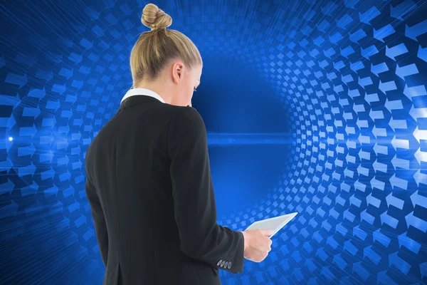 Composite image of businesswoman holding tablet — Stock Photo, Image