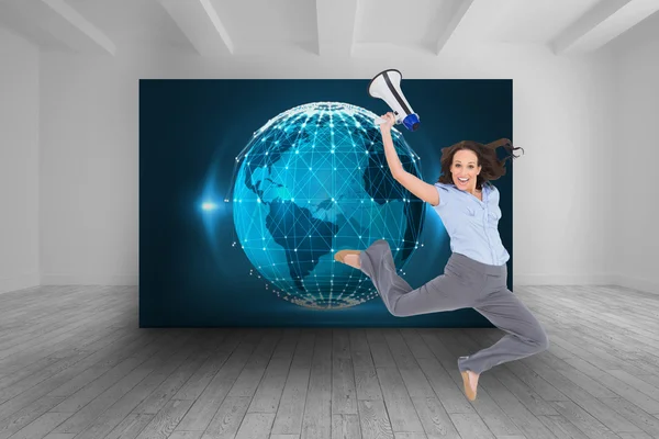 Cheerful classy businesswoman jumping while holding megaphone — Stock Photo, Image