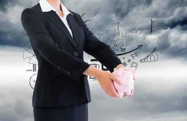 Businesswoman holding piggy bank — Stock Photo, Image