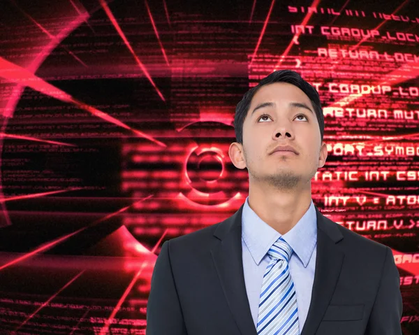 Composite image of serious asian businessman — Stock Photo, Image