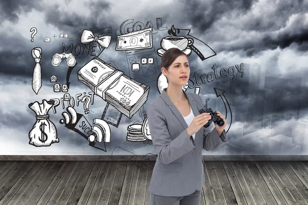 Curious young businesswoman with binoculars — Stock Photo, Image