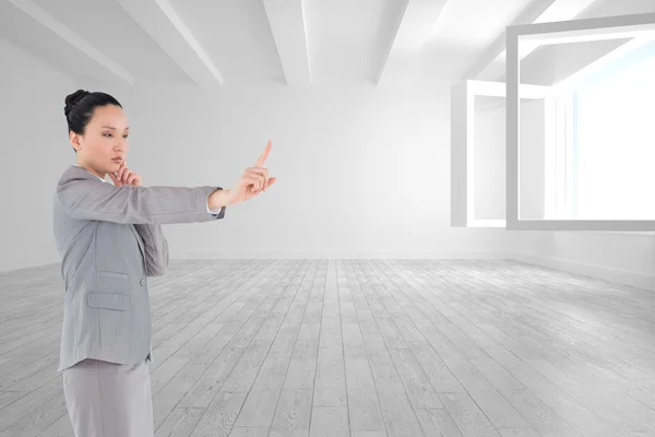 Compuesto imagen de reflexivo asiático mujer de negocios señalando — Foto de Stock