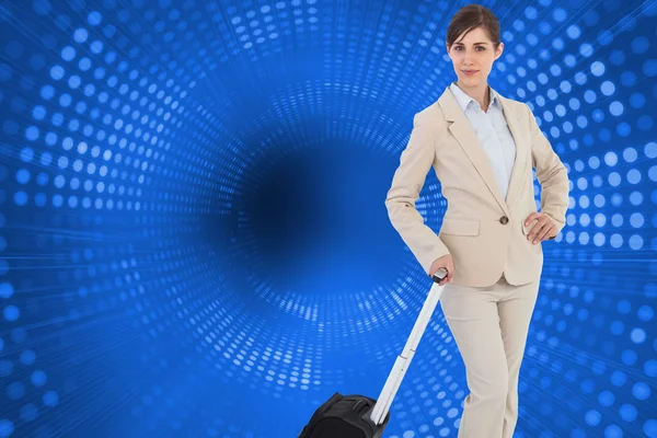 Composite image of businesswoman with suitcase — Stock Photo, Image