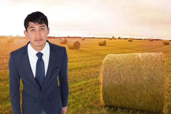 Composite image of unsmiling casual businessman walking — Stock Photo, Image