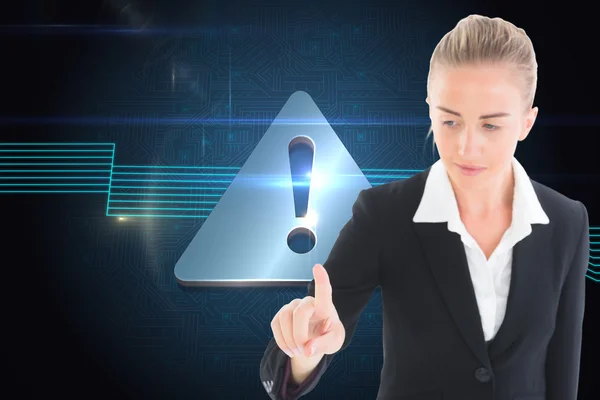 Composite image of businesswoman pointing somewhere — Stock Photo, Image