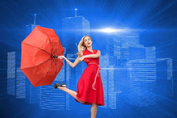 Sammansatt bild av eleganta blond anläggning paraply — Stockfoto