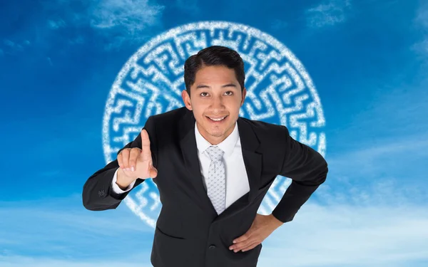 Composite image of smiling asian businessman pointing — Stock Photo, Image