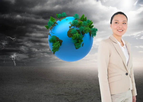 Composite image of smiling asian businesswoman — Stock Photo, Image