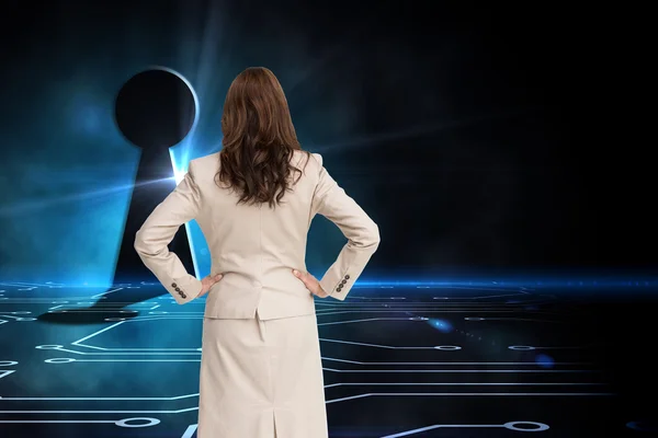 Composite image of businesswoman standing back to camera — Stock Photo, Image