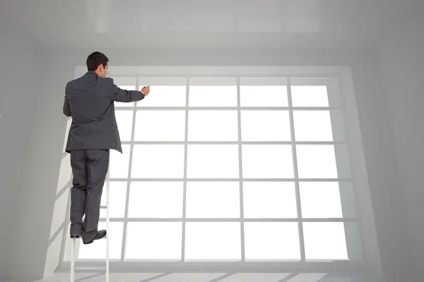 Композитный образ бизнесмена, стоящего на лестнице — стоковое фото