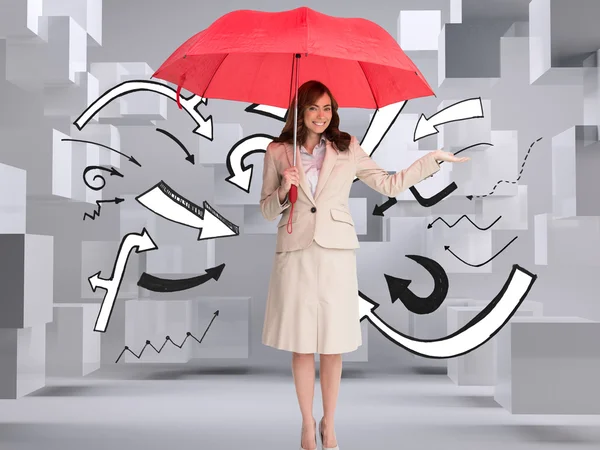 Happy brunette businesswoman holding umbrella — Stock Photo, Image