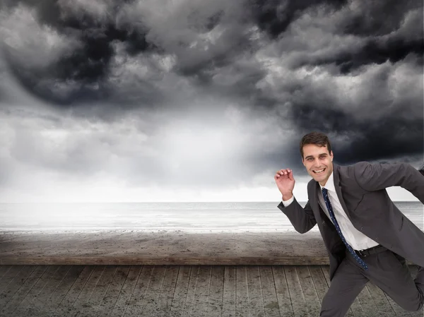 Cheerful businessman in a hury — Stock Photo, Image