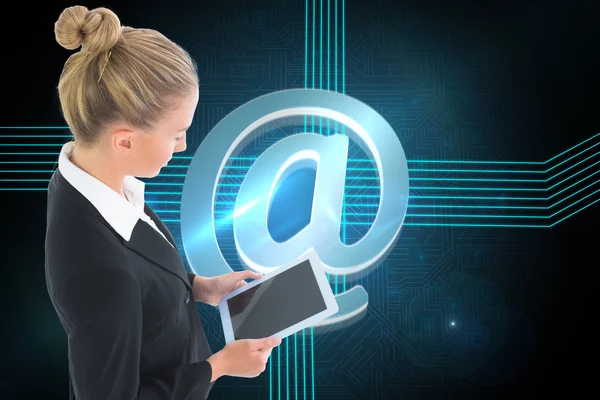 Composite image of businesswoman holding tablet — Stock Photo, Image