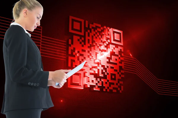 Blond businesswoman holding tablet — Stock Photo, Image